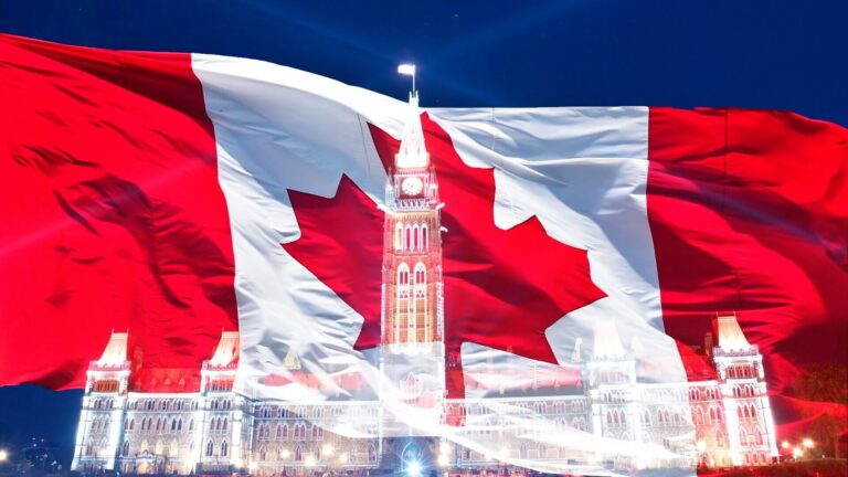 Relief of Parliament building with Canadian flag